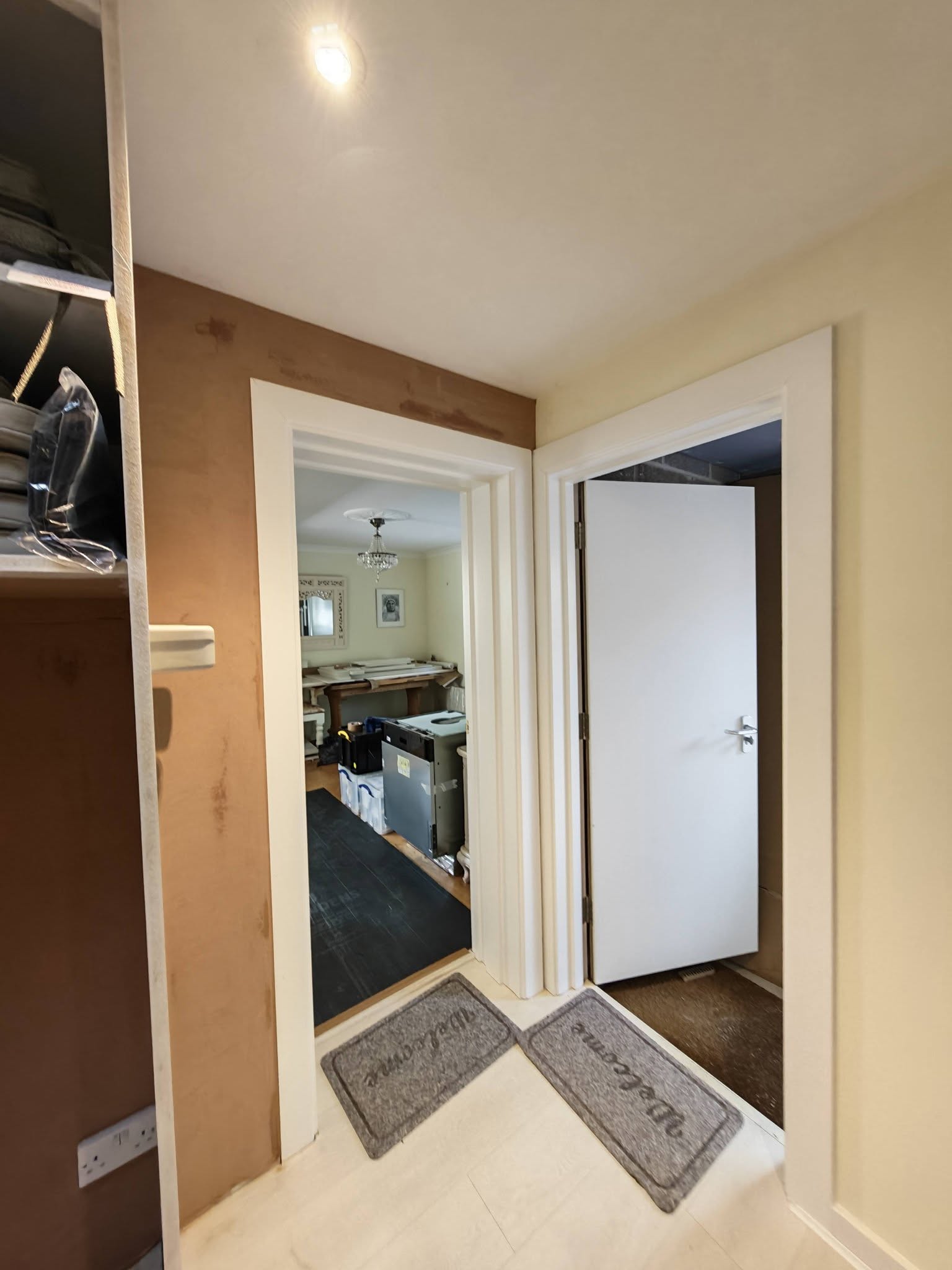 Hallway with fresh plaster around a new doorway